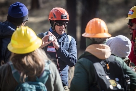 IMBA's community engagement coordinator, Joey Klein teaching at a Trail Care school in 2023. 