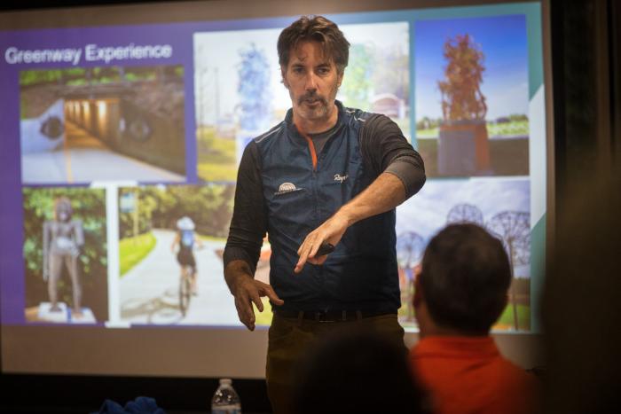 "Gary Vernon of the Walton Family Foundation speaks to Trail Labs participants about trail history in Bentonville"