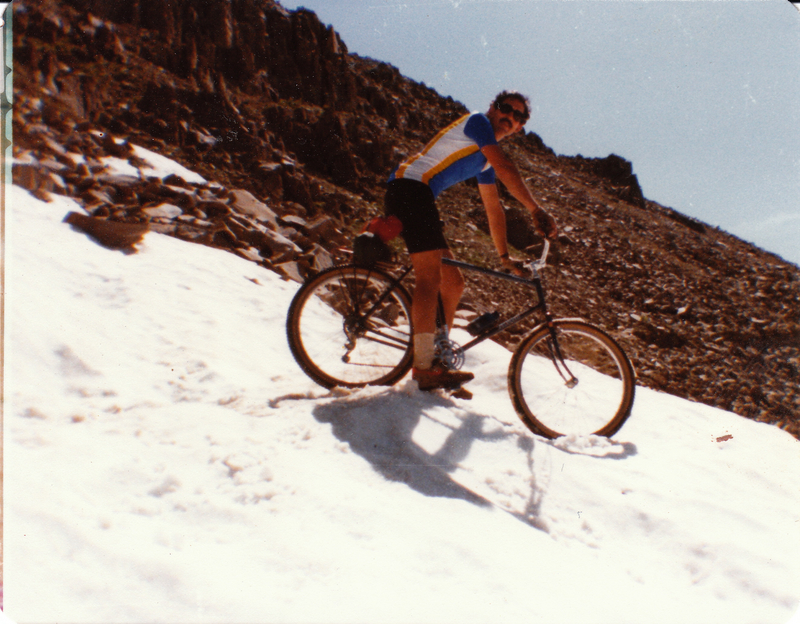 "Biking down snowy Triangle Pass"