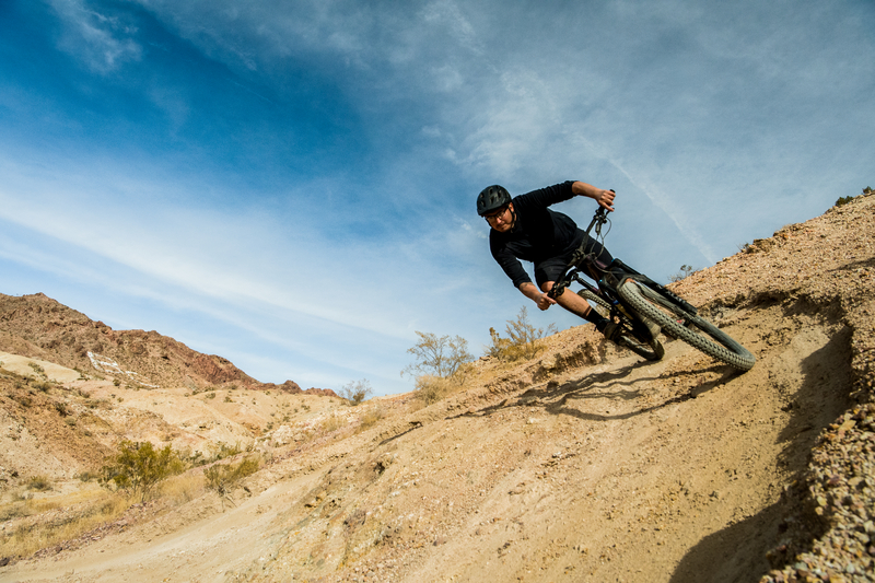 "Eric Arce riding an eMTB on a berm"