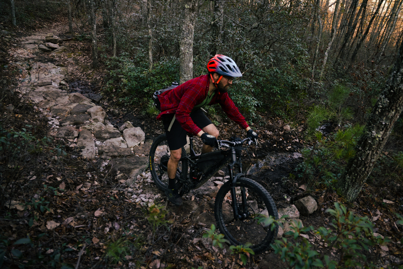 "Mountain biker riding down singletrack"