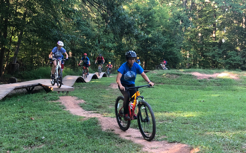 "Youth riders practicing on the wooden features at Brookfield"