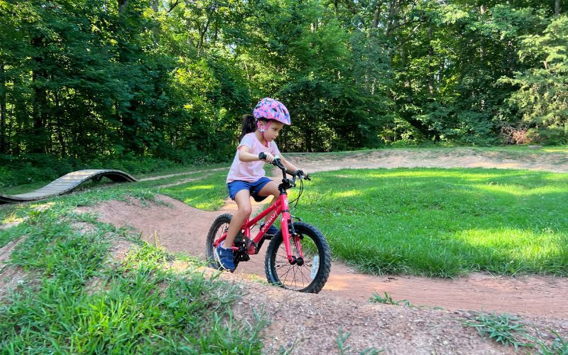 "A young girl riding on the Brookfield pumptrack"