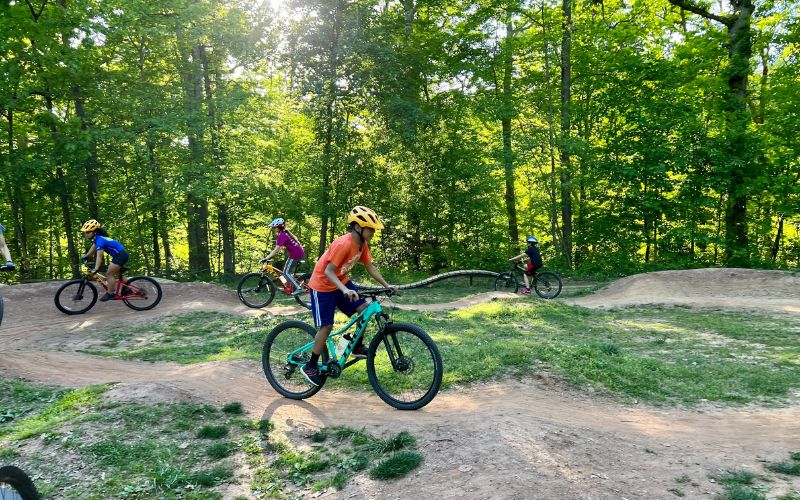 "Omar doing laps on the dirt pumptrack in Brookfield Park"