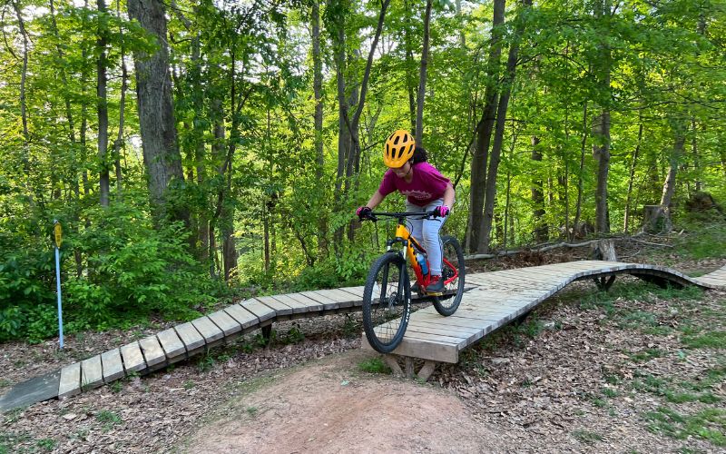 "Pamela practices dropping from one of the wooden features"