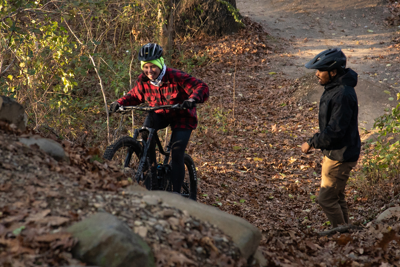 "Anson coaching a rider up a climb"