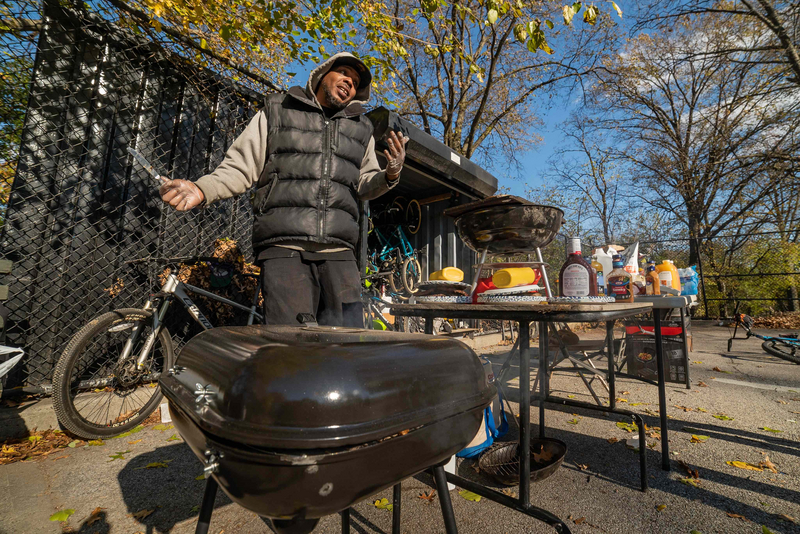 "Q working the grill during a gathering at Highbridge Park"