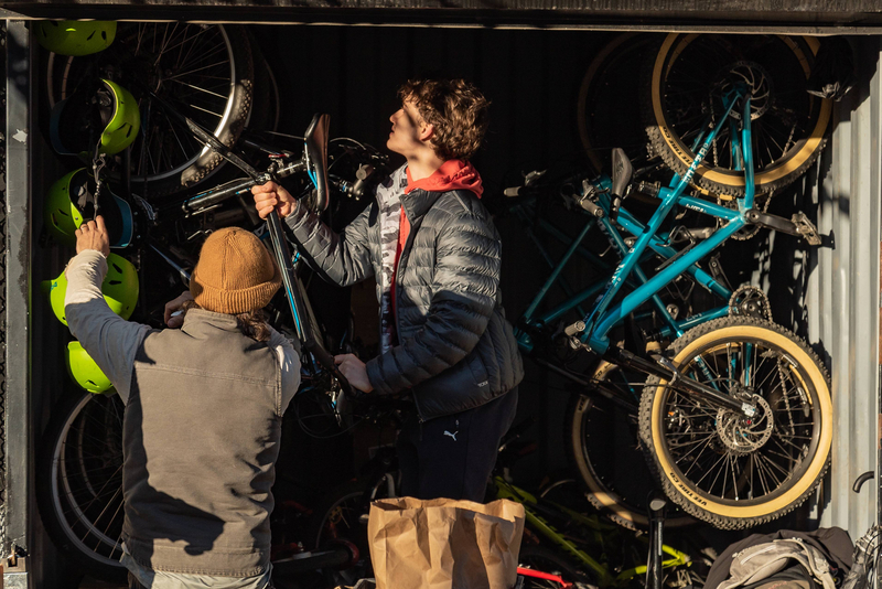 "Storage container with bikes, helmets, tools"