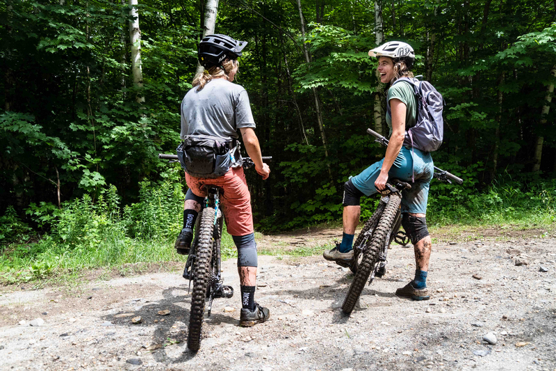 "Two women talking on a trail"