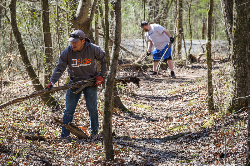 "Volunteers clearing a trail in Wildwood Park"