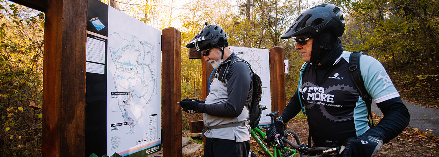 Mountain bikers referencing trail map in 2017. 