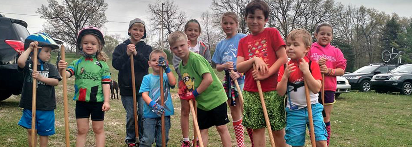 Kids volunteering for a dig day in their local community. 