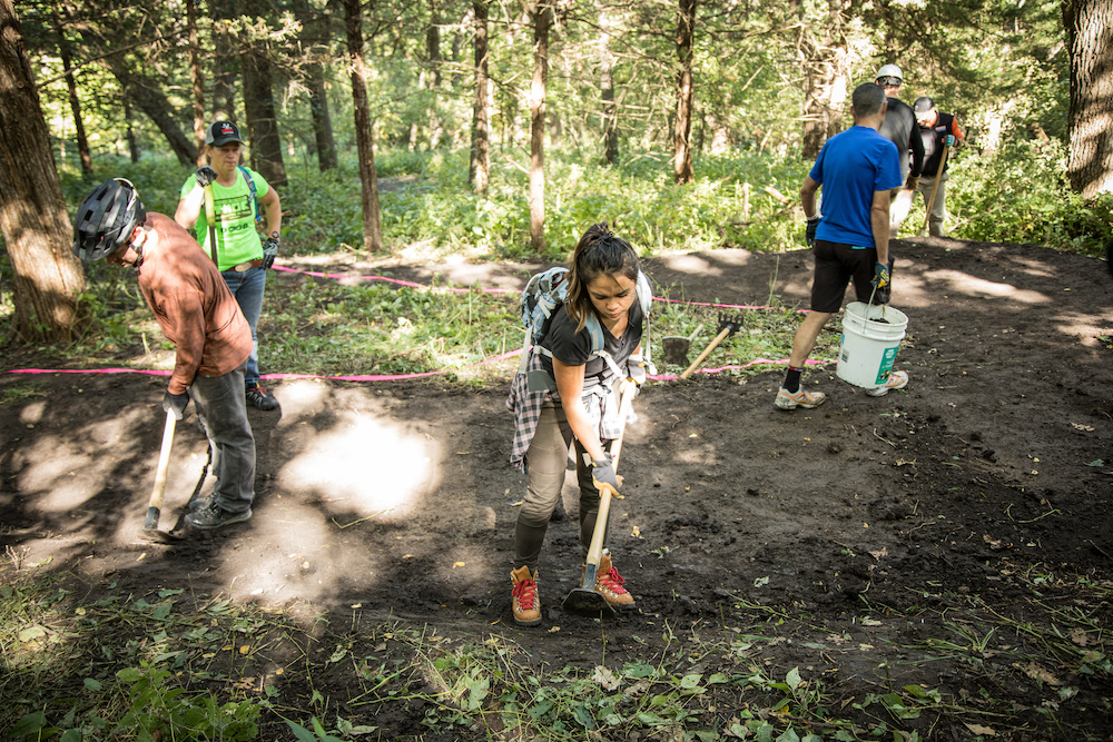 Group of trail care school attendees learning trail maintenance 