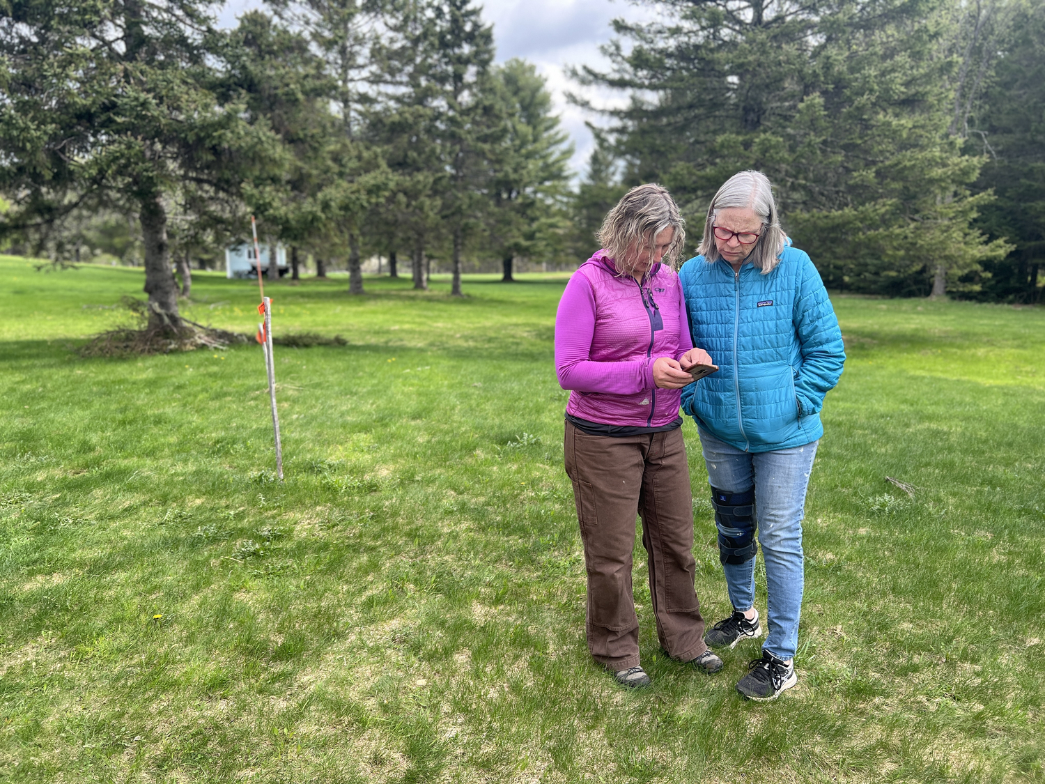 "two women looking at a digital map"