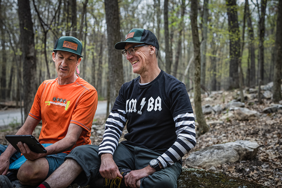 Joey Klein (left) and Chris Orr look over a trail design together at Cacapon Resort State Park.