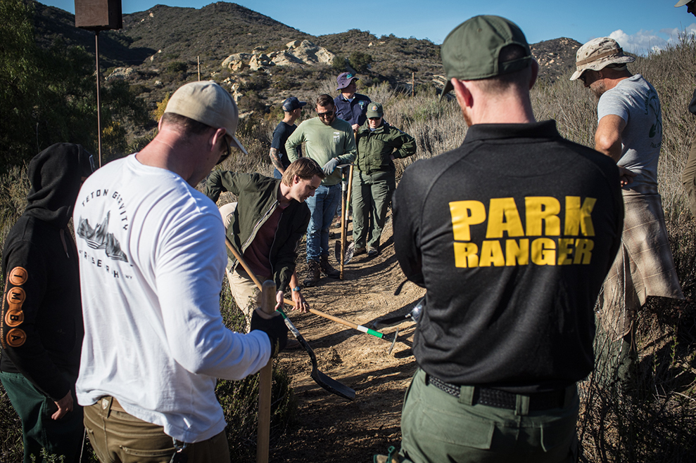 Group of land managers learning about nicks during an IMBA Trail Management School.