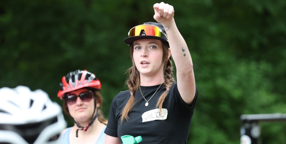 Jolie Costello gives directions at a Women's Mountain Biking Day event in Des Moines, IA.