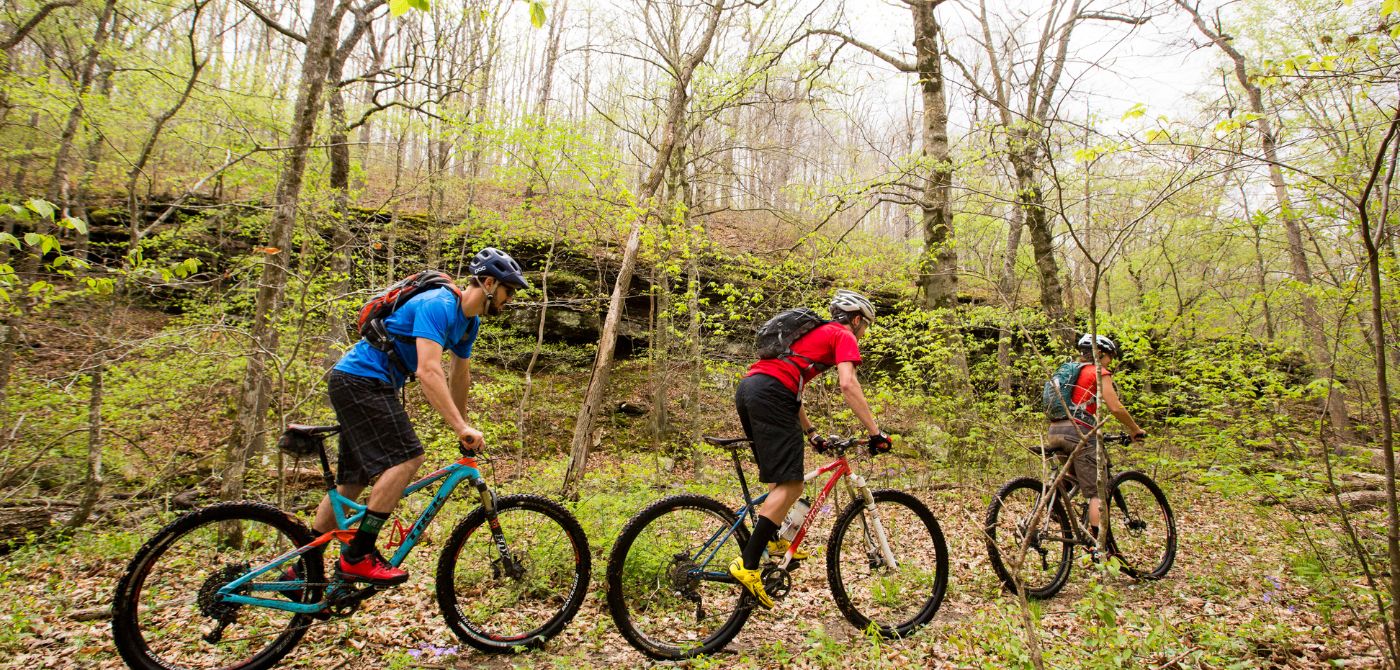Three people riding mountain bikes in Northern Arkansas
