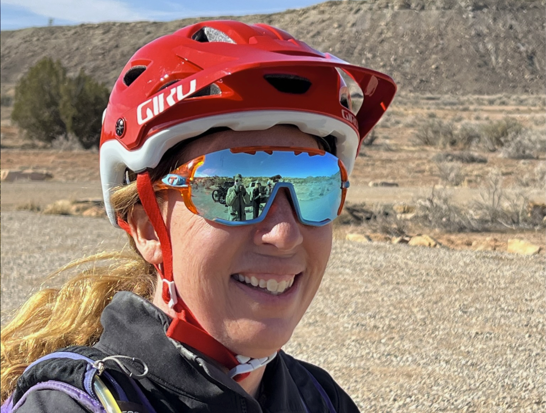 A closeup of of Dr. Jen with mountain biking helmet on. 