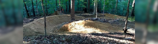 Four mountain bikers on a trail in Windy Ridge, Mount Airy MD