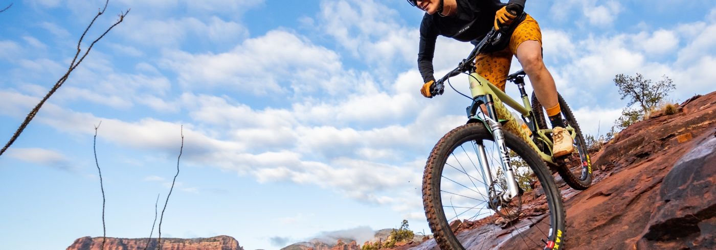 mtber riding on red rock