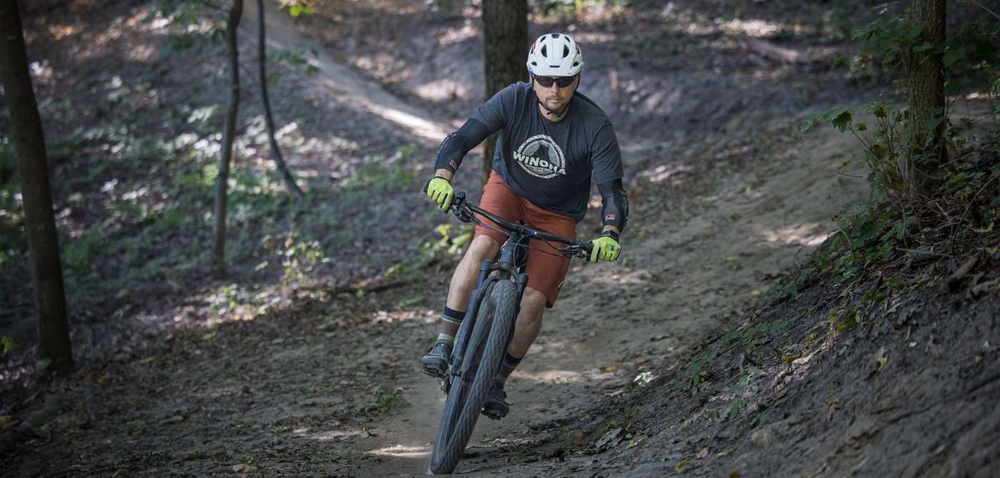 a rider descends a purpose built mountain bike trail