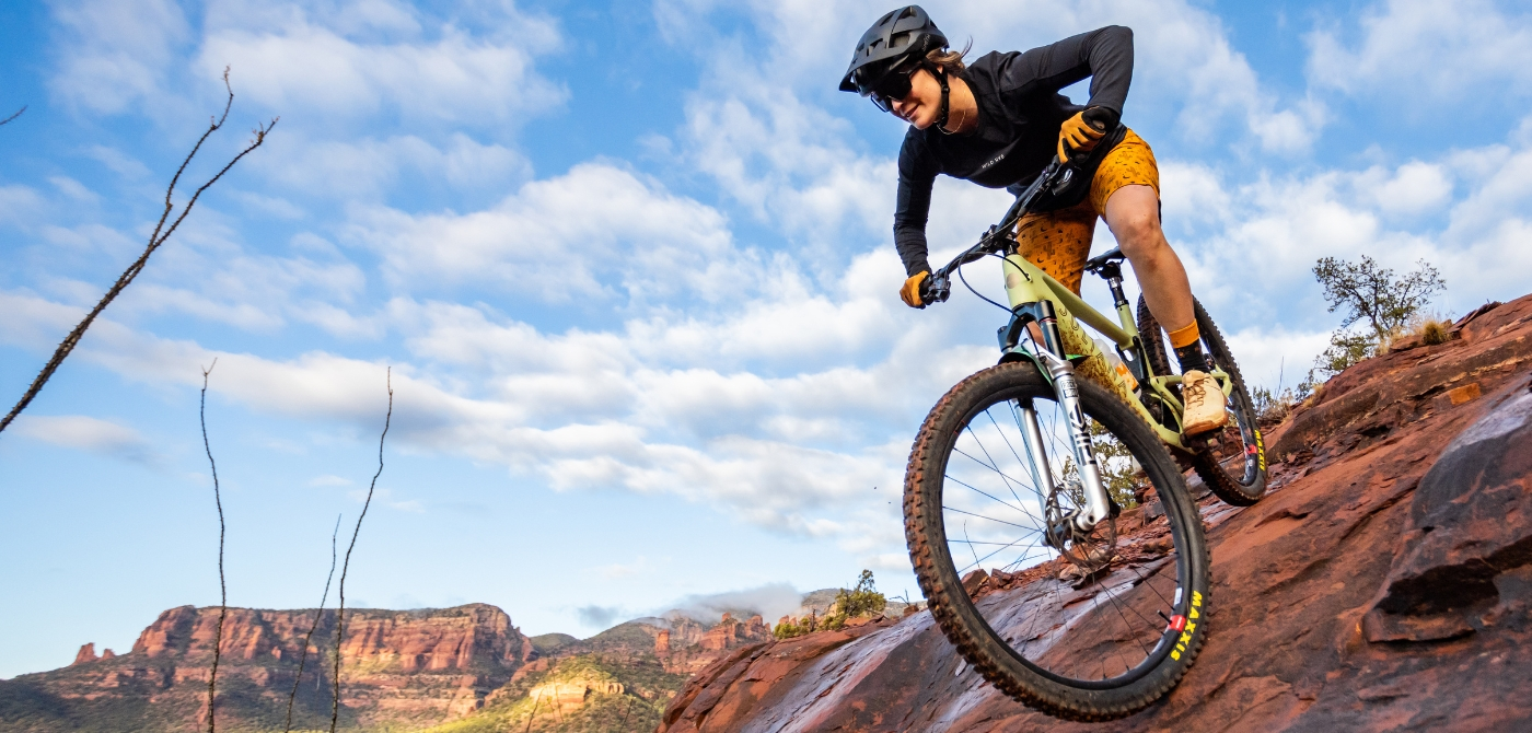 mtber riding on red rock