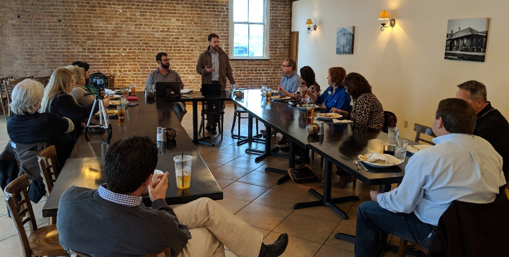A group of people meeting over lunch