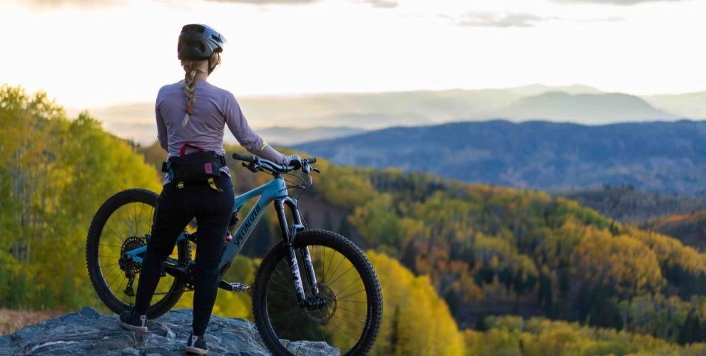 Mountain biker from behind looking at the view of Routt National Forest