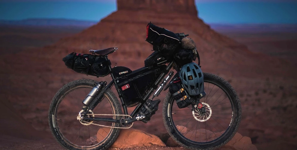 Bike loaded with packing gear, with desert background