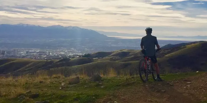 rider looking out over hazy city