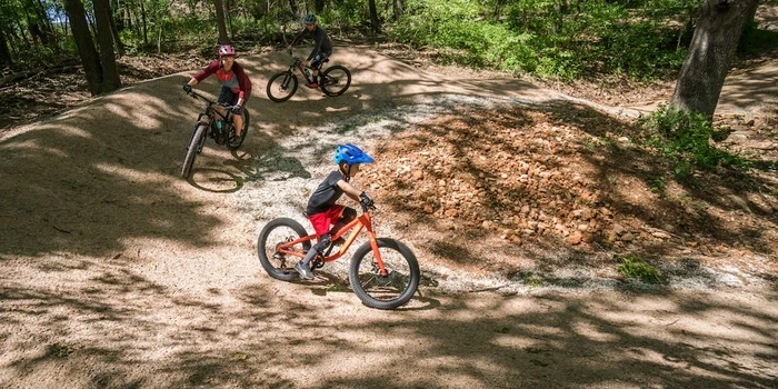 Family Mountain biking on community, kid-friendly trails