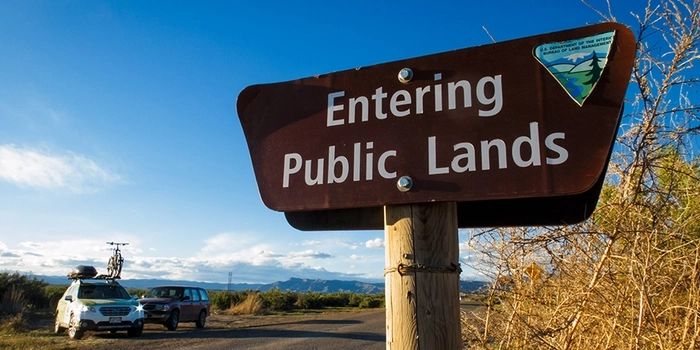 Entering public lands blm sign in brown.