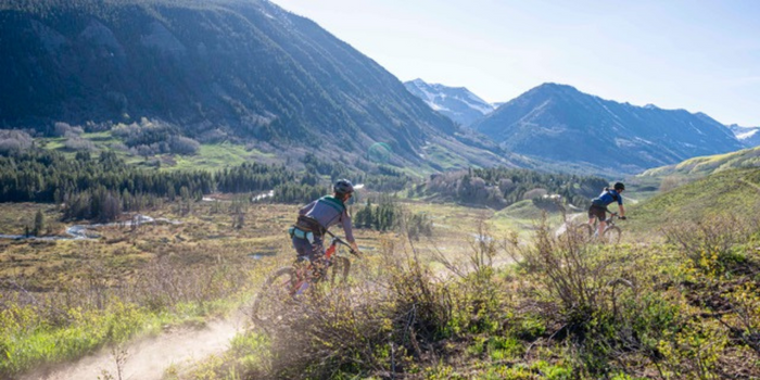 Two women riding mountain bikes in Crested Butte, CO