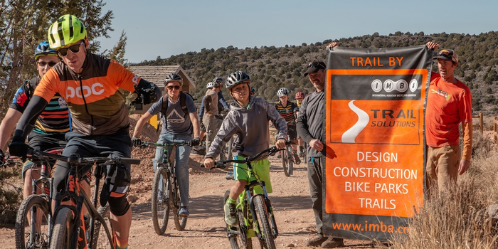 Group of mountain bikers riding at a trail opening in Cedar City, UT.