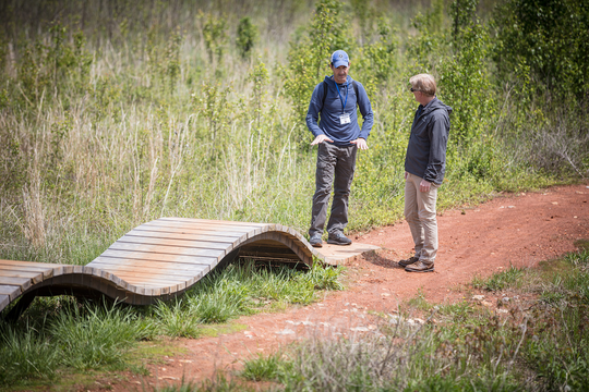 IMBA Trail Solutions, Joey Klein, teaching on trail at a trail management workshop
