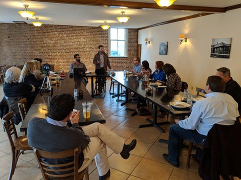 A group of people meeting over lunch