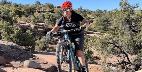 Dr. Jennifer Caragol, ripping some singletrack near Moab, Utah on a trail called Porcupine.