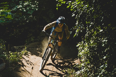 Person riding trail on mountain bike