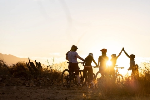 Community of mountain bikers on a group ride.