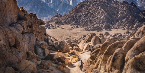 mountain biker riding on southwestern public lands rocky terrain