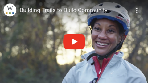 Screen shot from video of a woman on trails