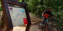 Hub sign with mountain biker in background, Hot Springs AR
