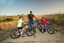a smiling family riding together