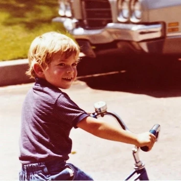 Jacob Rheuban riding a bike in 1982