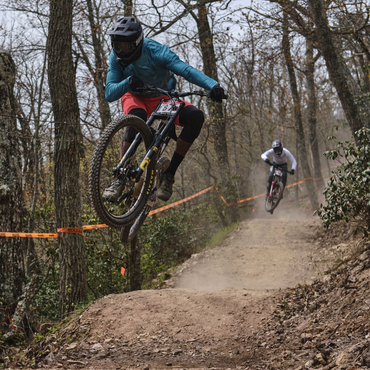 Korey riding a down a flow line