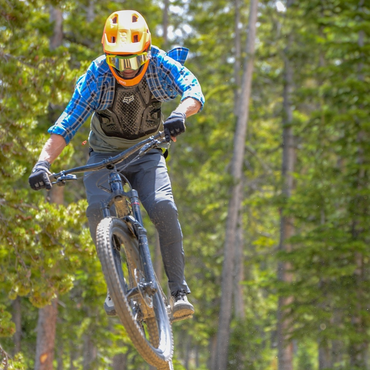 Joe Vadeboncoeur - Vice President of IMBA Trail Solutions sending a jump on his mountain bike.