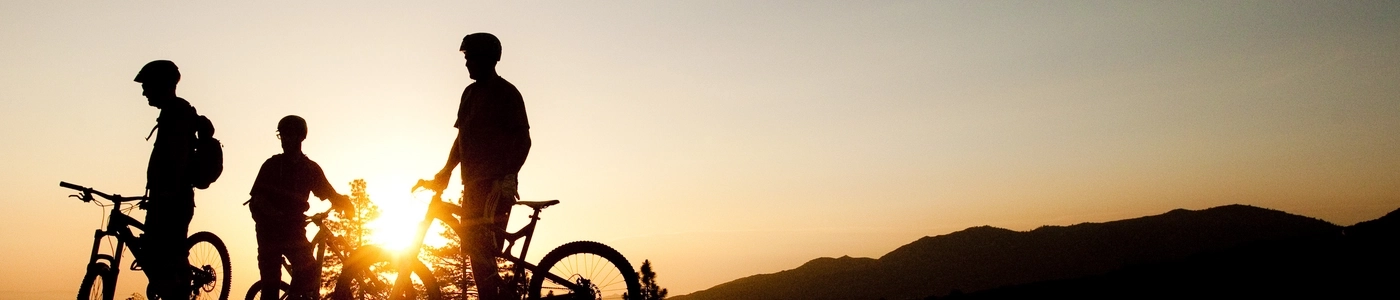 Silhouettes of riders at sunset.