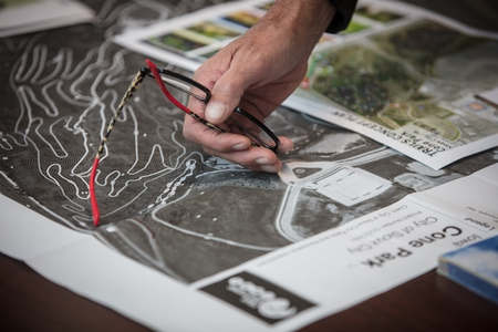 Person pointing to IMBA resource