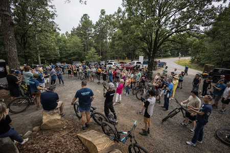 Mountain bikers gathered for the grand opening of a trail system in their community. 